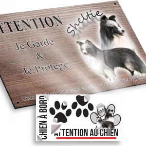 Plaque attention au chien Un Sheltie avec un pelage noir et blanc