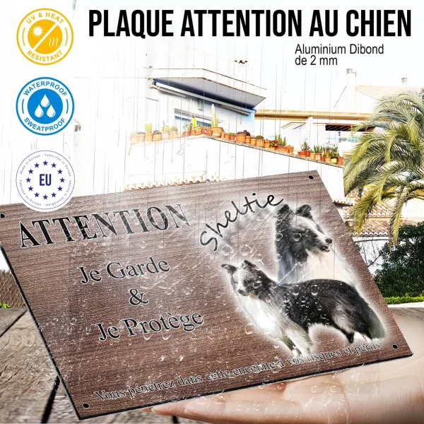 Panneau attention au chien Un Sheltie avec un pelage noir et blanc