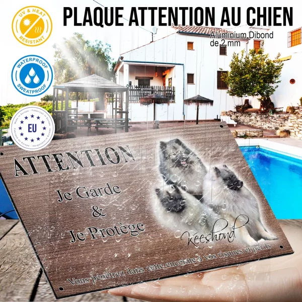 Panneau attention au chien Trois Keeshonds aux pelages gris et noir