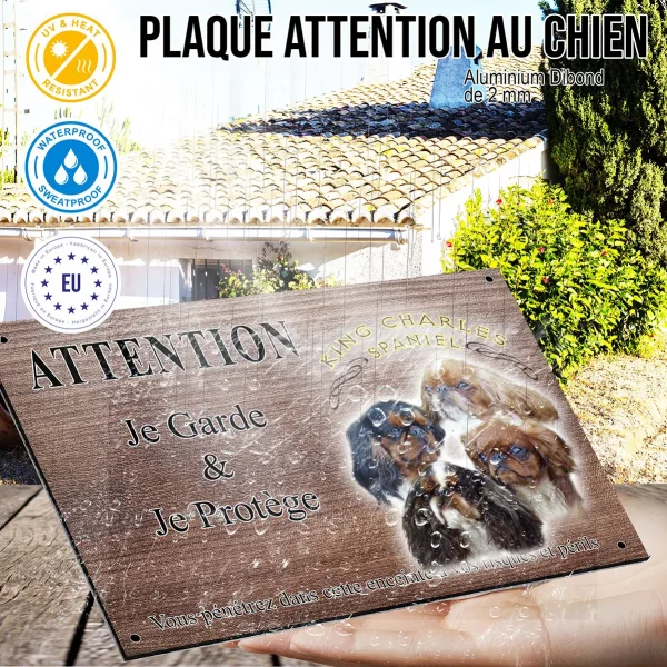 Panneau attention au chien Quatre chiens King Charles Spaniel sur fond noir