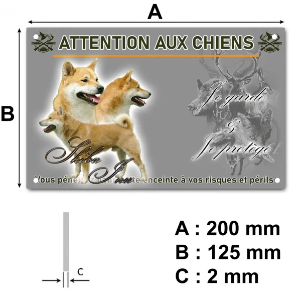 Panneau Trois Shiba Inu sur un fond flou