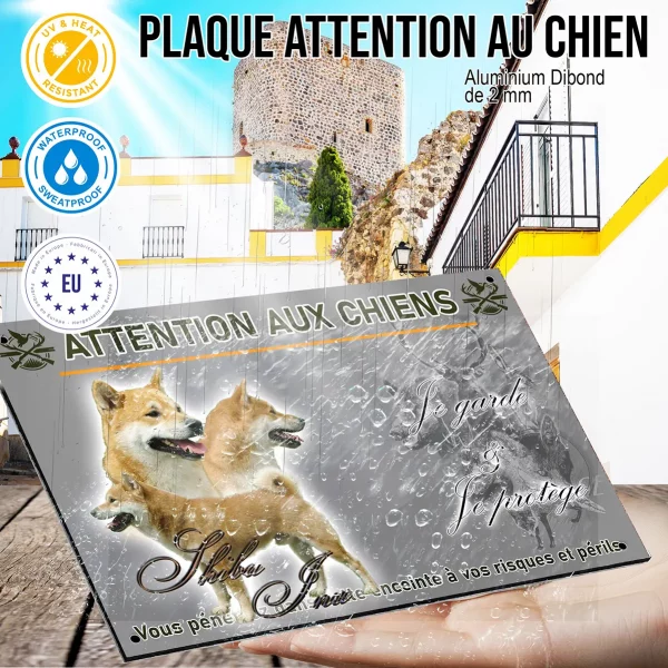 Panneau Trois Shiba Inu sur un fond flou