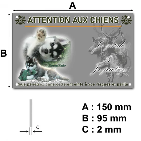 Plaque Deux chiots Siberian Husky jouent sur l'herbe verte