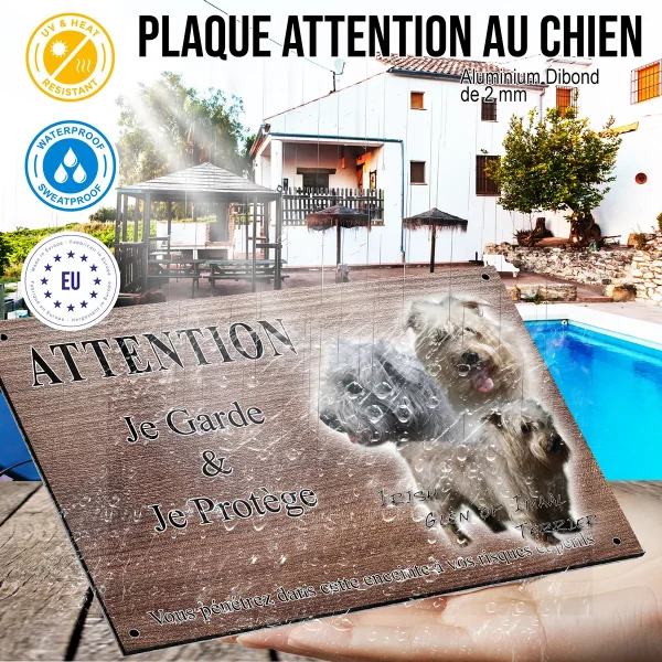panneau attention au chien Trois Irish Glen of Imaal Terriers avec un fond flou.